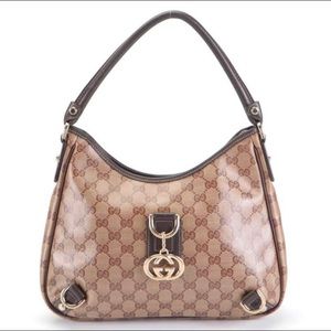Gucci Abbey small hobo shoulder bag in GG crystal canvas and dark brown leather.